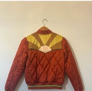 Rising Sun Quilted Jacket in Rust and Teal